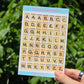 a sticker sheet of alphabet letters in the shape of board game tiles