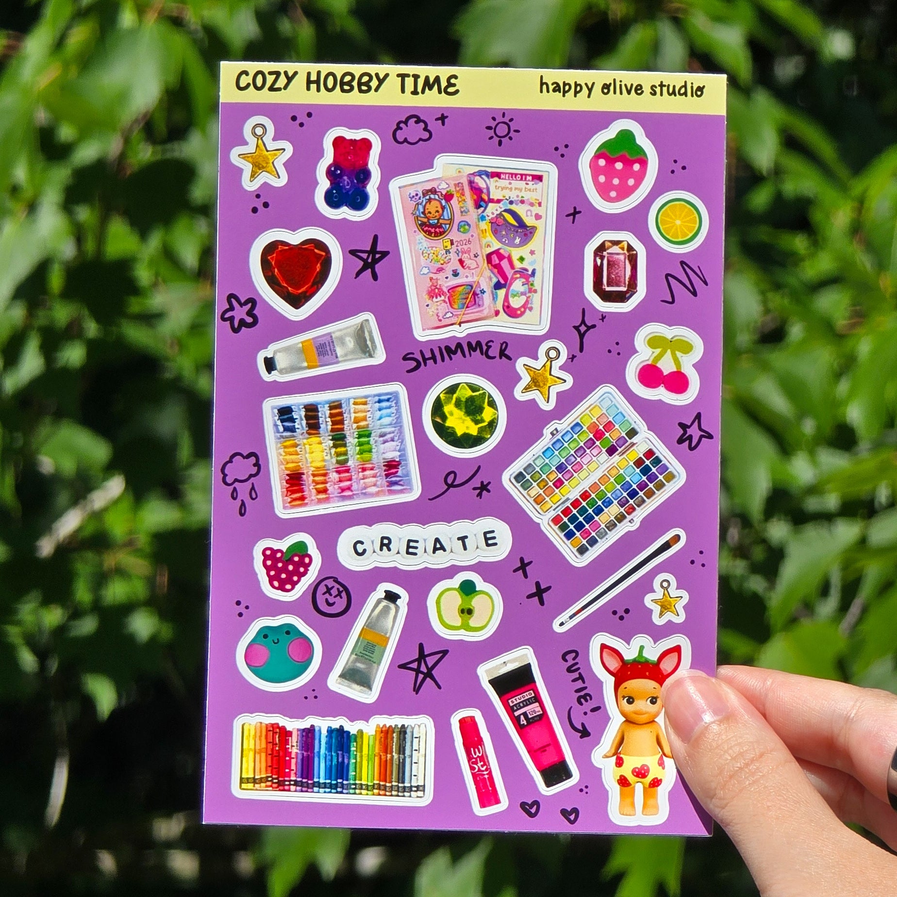sticker sheet featuring scans of my favorite analog hobbies and trinkets.