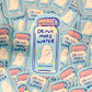 Sticker with 'Drink More Water' text on a blue background, surrounded by similar stickers.